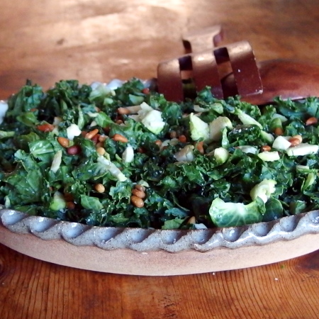 Raw Kale and Brussels Sprouts Salad with Toasted Pinenuts and Parmesan Cheese